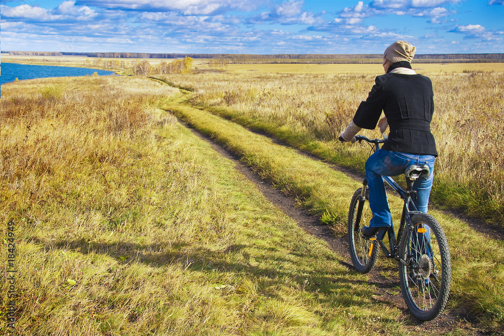 The woman and a bicycle