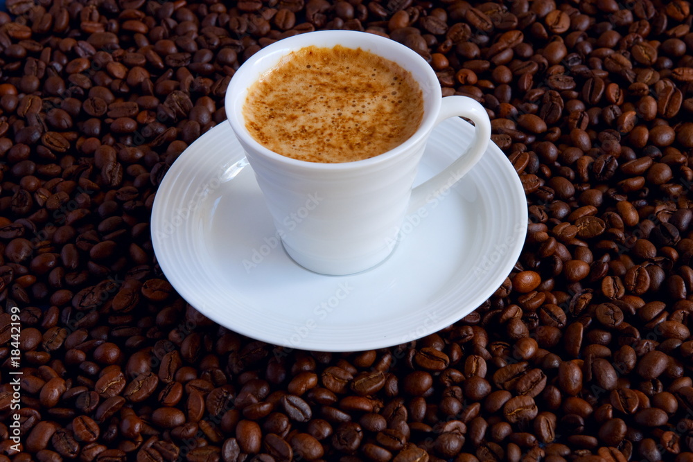 Cup with coffee, costing on coffee grain Cup with coffee, costing on coffee grain