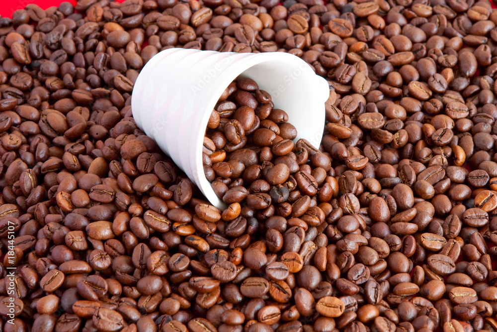 Fototapeta premium a cup filled with coffee beans