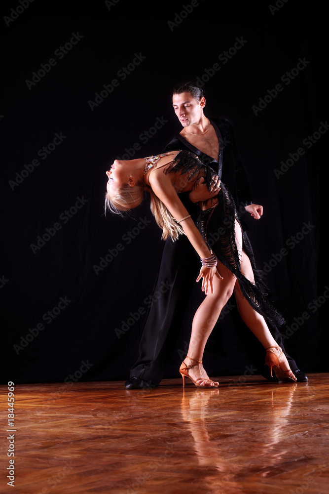 dancers in ballroom against black background dancers in ballroom against black background