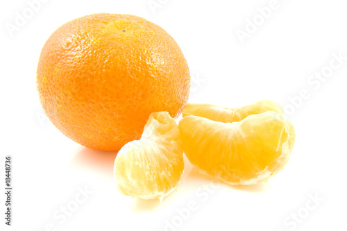 whole mandarin and parts over white background