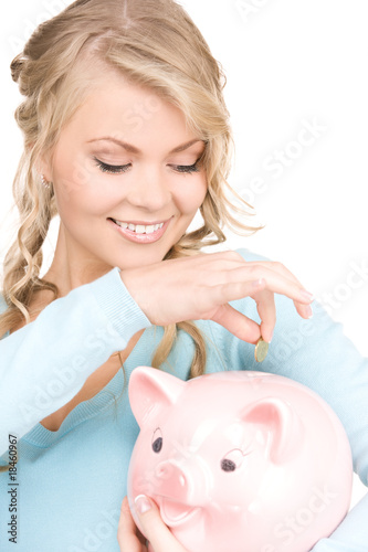 lovely woman with piggy bank