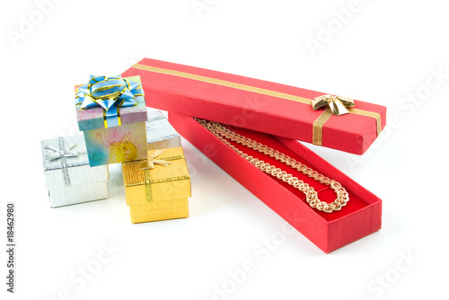 gold necklace in red box photo