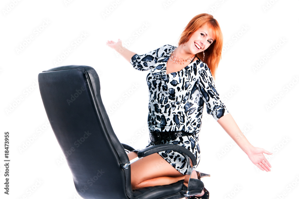 Fototapeta premium Pretty beautiful young girl on armchair