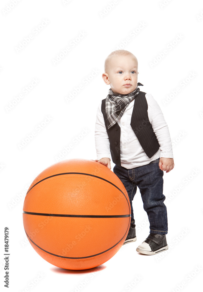 Fashion boy playing whit a huge basketball Fashion boy playing whit a huge basketball