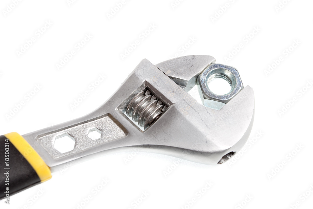 Obraz premium Wrench and nut on white background