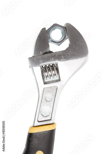 Wrench and nut on white background