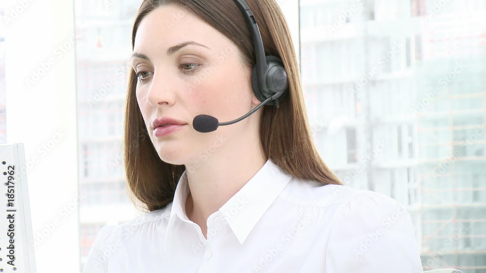 Close-up of serious woman working in a call center Close-up of serious woman working in a call center