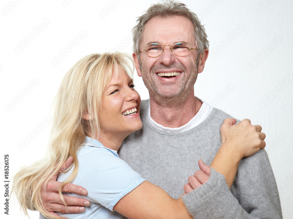 smiling adult couple hug each ohther smiling adult couple hug each ohther
