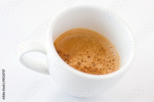 Coffee cup on white background with shallow depth of field
