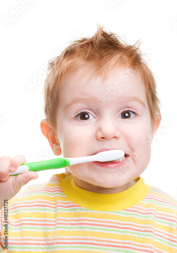 Little child with dental toothbrush brushing teeth.isolated
