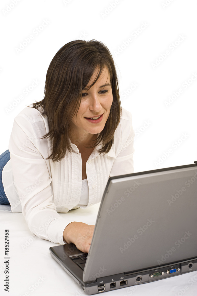 Attractive young lady working on a laptop computer Attractive young lady working on a laptop computer