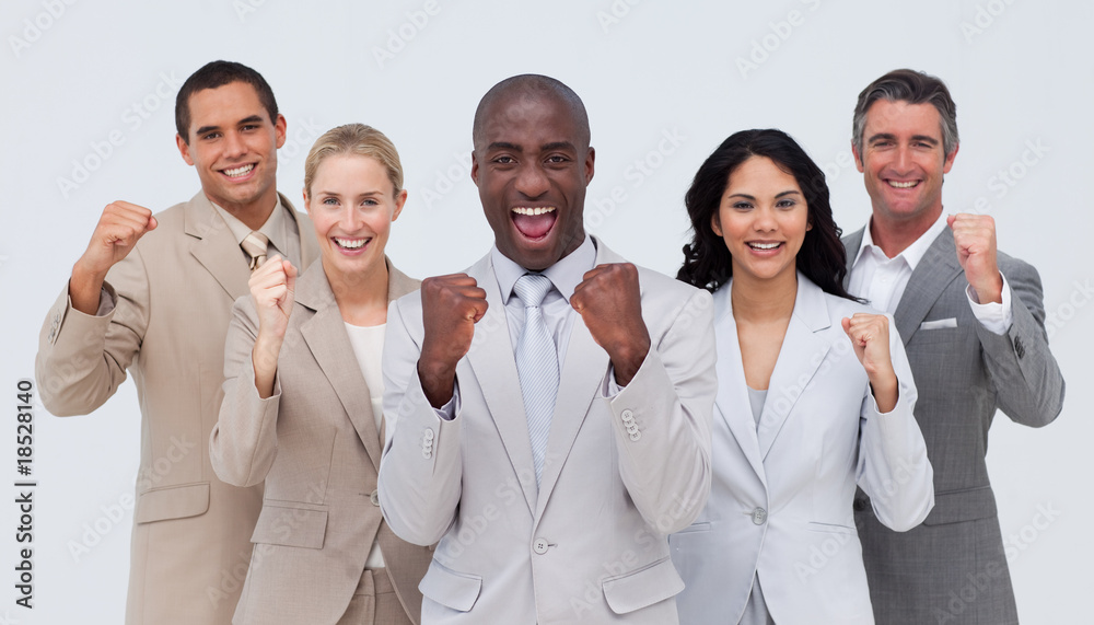 Happy and positive business team standing and smiling Happy and positive business team standing and smiling