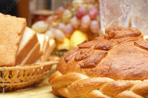 Bread (round loaf and slices of bread) photo