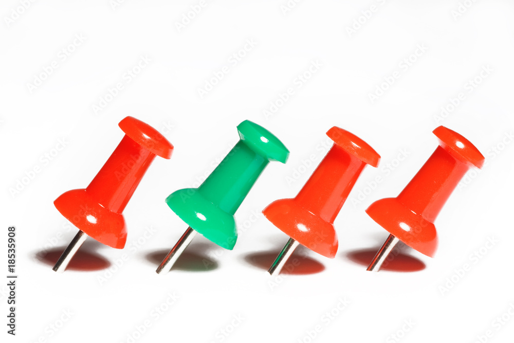 red and green pushpins macro, isolated on white red and green pushpins macro, isolated on white