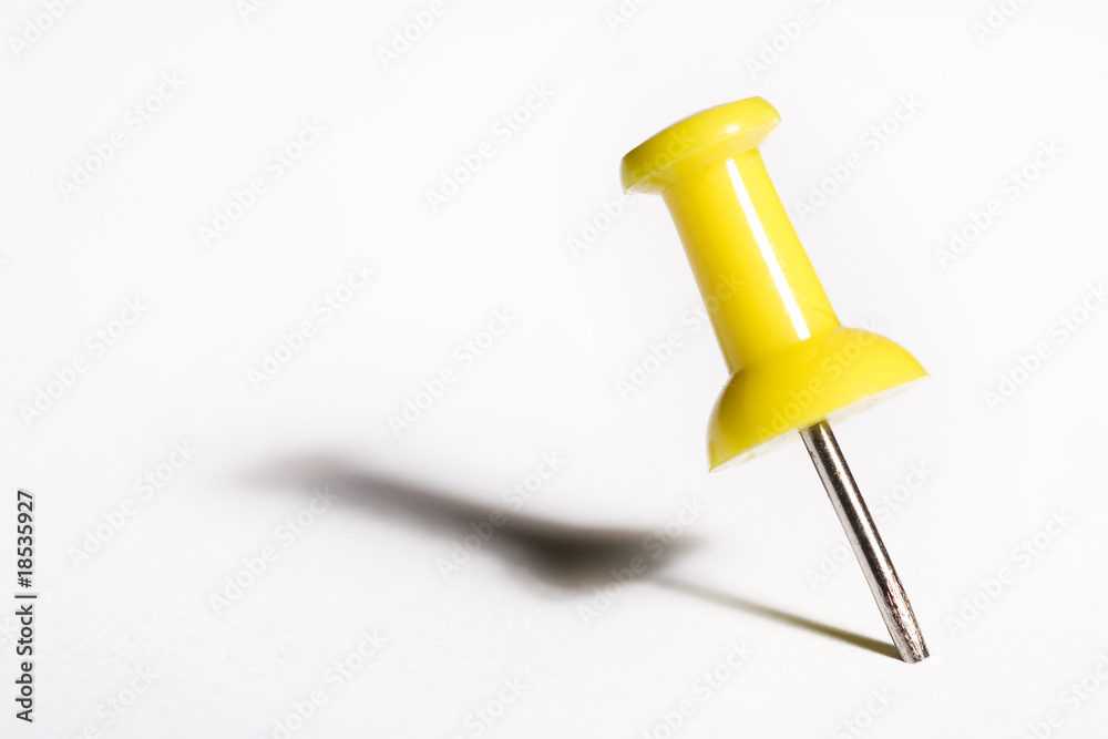 Yellow pushpin macro, isolated on white Yellow pushpin macro, isolated on white