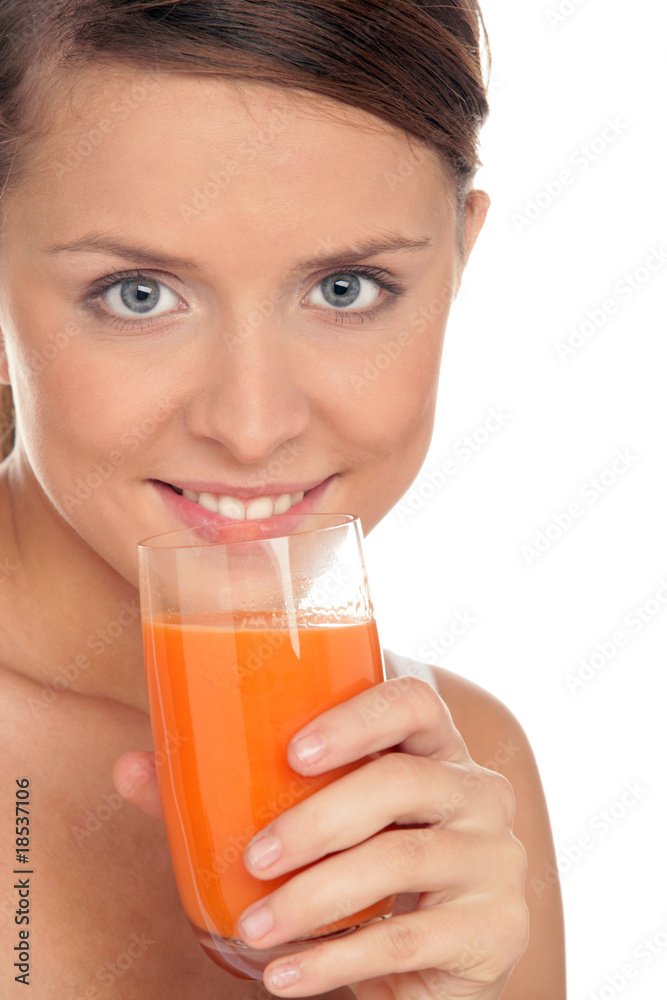 Young woman with glass of carrot juice Young woman with glass of carrot juice