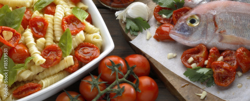 Pasta tomatoes and fish