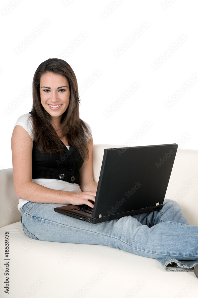Young woman with laptop on couch, isolated on white Young woman with laptop on couch, isolated on white
