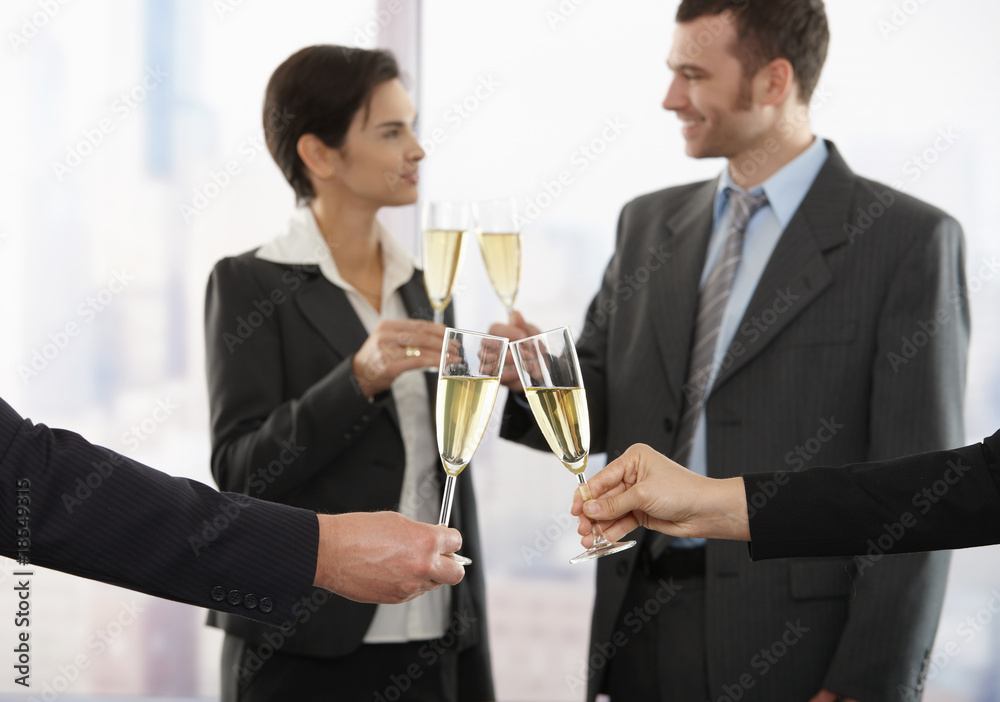 Business people celebrating with champagne Business people celebrating with champagne