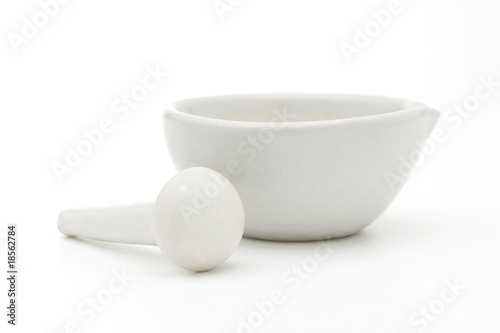 White mortar and pestle over white background