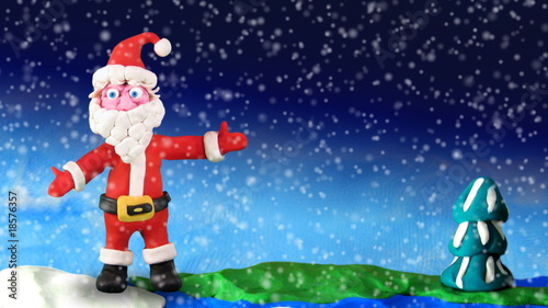 Santa Claus dance on earth - plasticine, loop photo