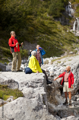 hikers on small stream