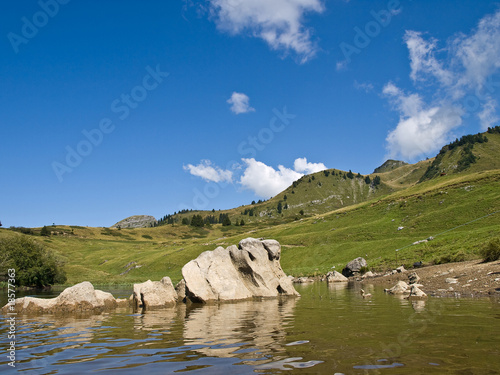 Mountain lake in Alps photo