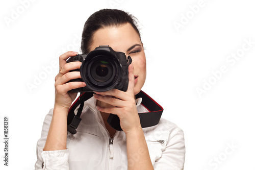 The girl with the camera on a white background
