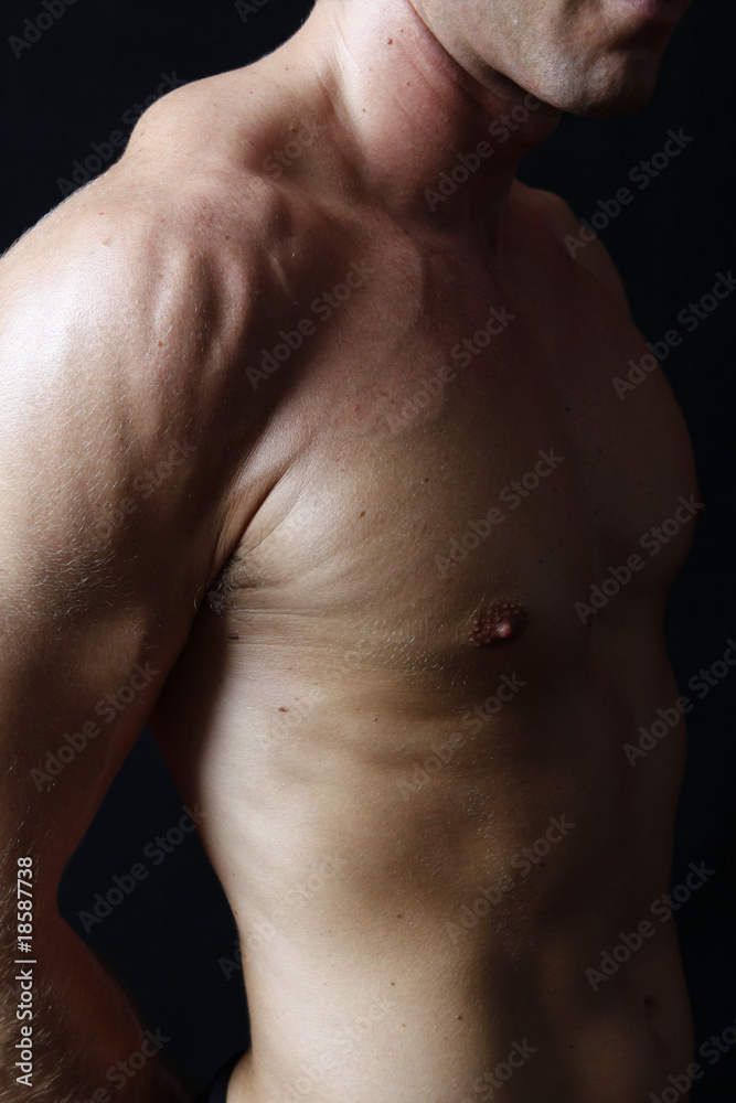muscular male torso on black background muscular male torso on black background