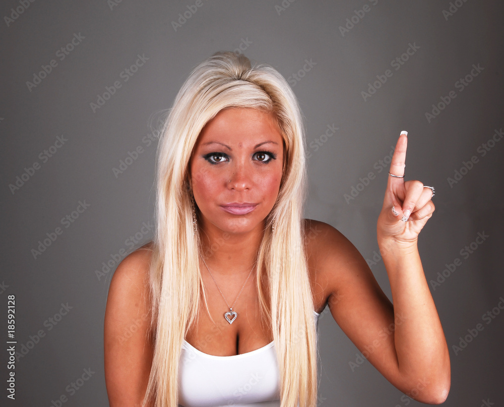 Blond lady pointing finger up. Blond lady pointing finger up.