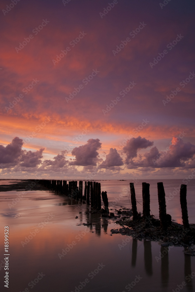 Romantic and dramatic red sunset over the Wadden sea