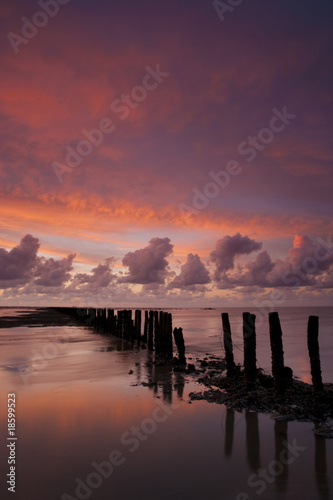 Romantic and dramatic red sunset over the Wadden sea