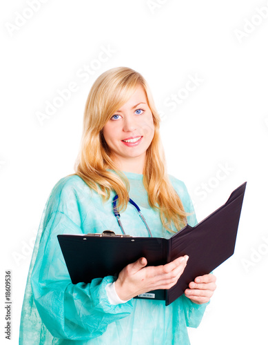 smiling female doctor with stethoscope holding clipboard