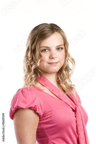 Headshot portrait of teenage girl in pink blouse © mocker_bat