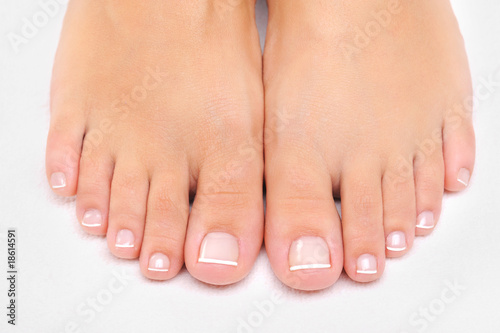 female feet with the French pedicure