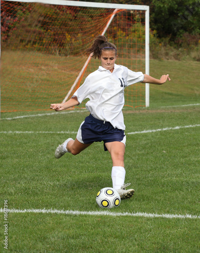Teen Soccer Player In Action