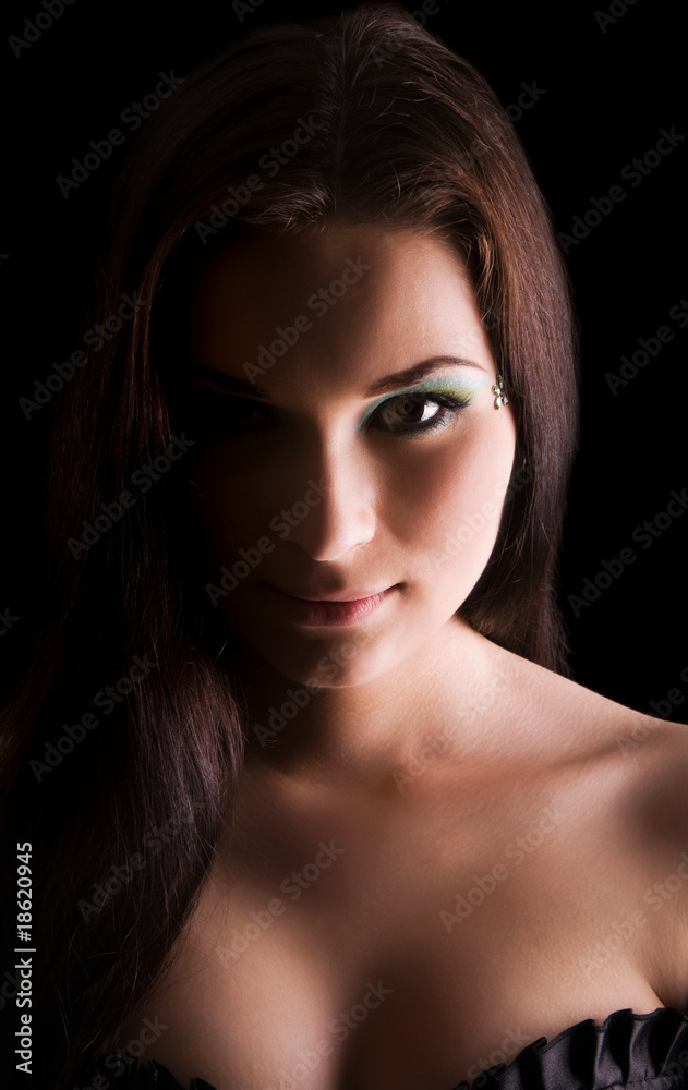 Young beautiful woman's dramatic light portrait Young beautiful woman's dramatic light portrait