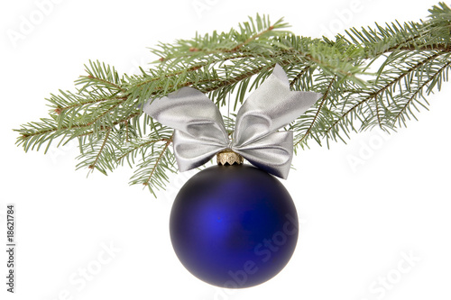Christmas blue bauble on tree branch