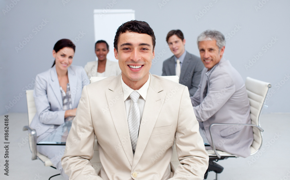Young businessman smiling in a meeting Young businessman smiling in a meeting