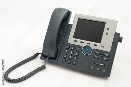 Modern telephone on white