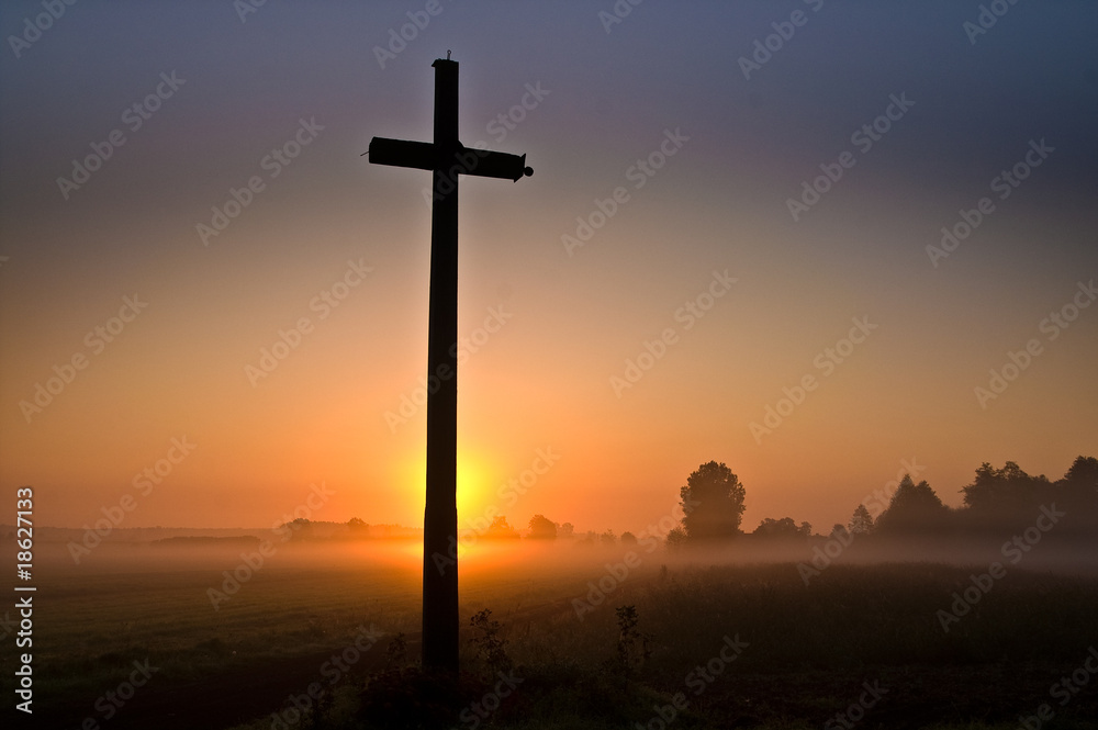 cross against the setting sun