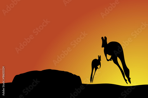 Kangaroos jumping towards Uluru