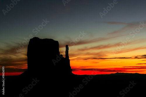 Landscape of a dramatic sunrise with rock formations silhouetted