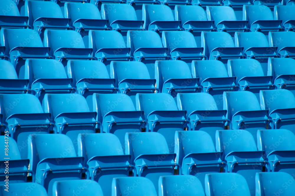 Empty folding blue stadium seating. Empty folding blue stadium seating.