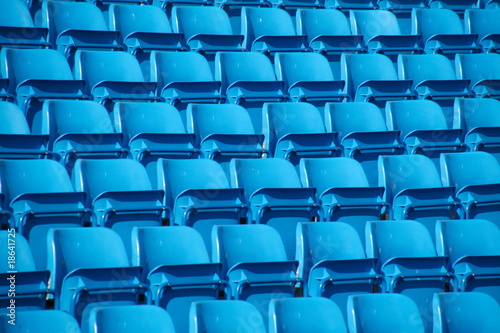 Empty folding blue stadium seating.