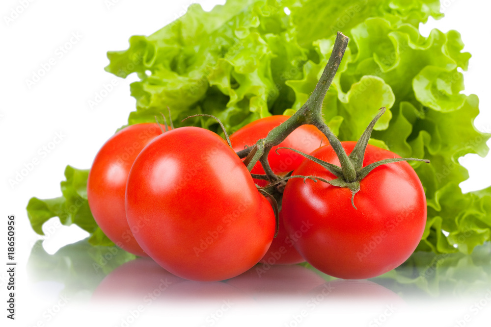 Ripe red tomatoes and green leaves of salad. Ripe red tomatoes and green leaves of salad.