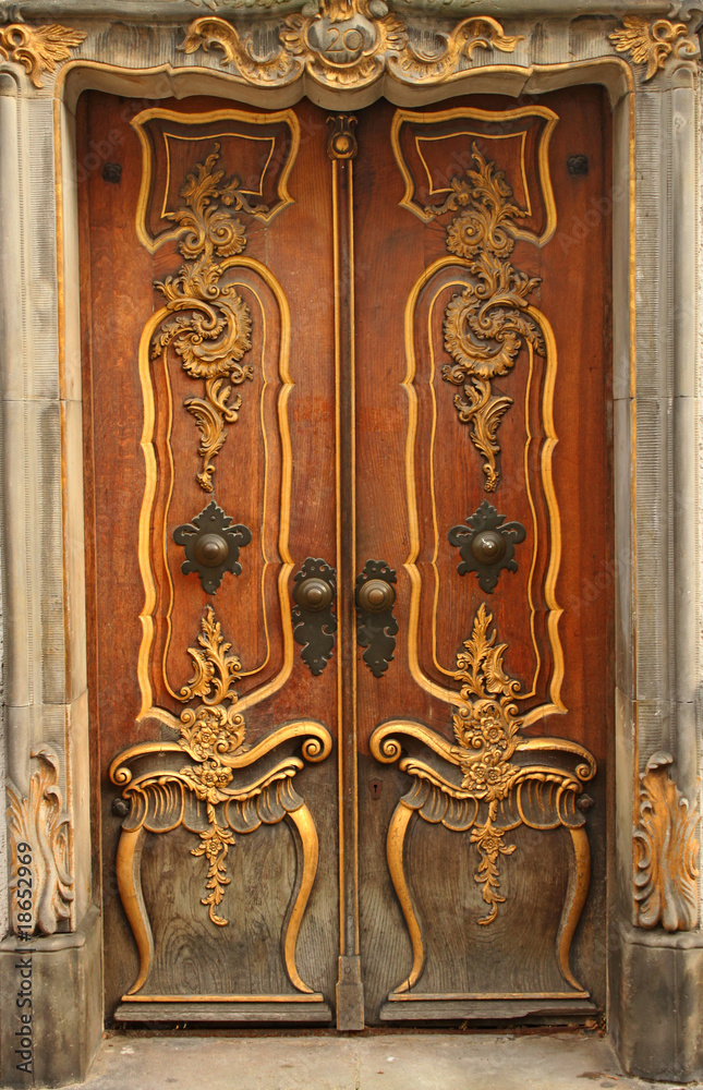 Old door with gold ornaments Old door with gold ornaments