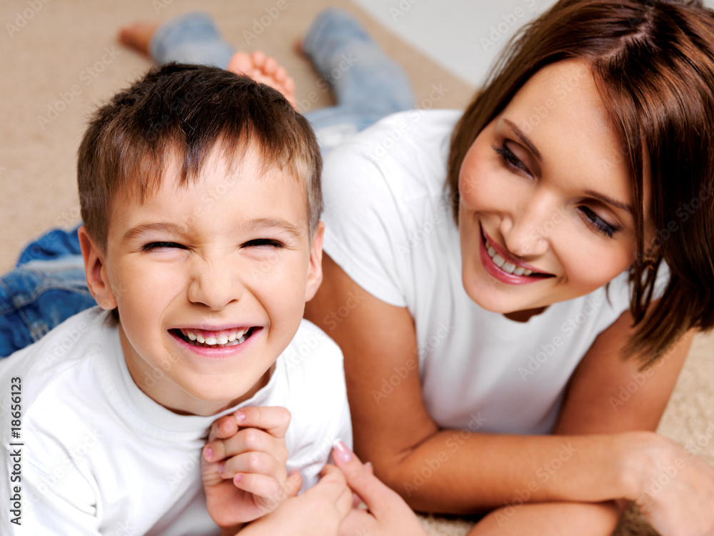 happy laughing preschooler boy with his pretty young mother happy laughing preschooler boy with his pretty young mother