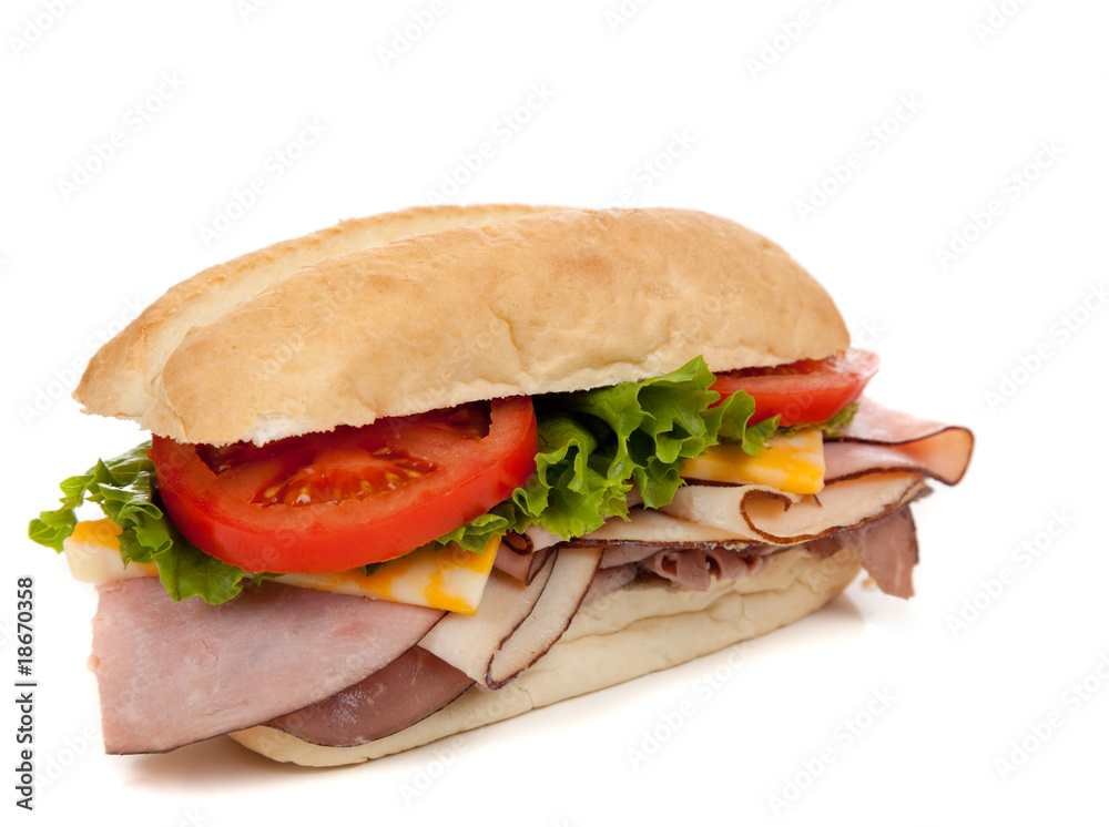 Assorted meat sandwich with fixings on a hoagie Assorted meat sandwich with fixings on a hoagie